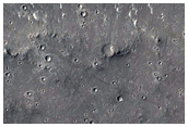 Flows and Small Mounds in and Near THEMIS Image V12115003