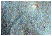 Crater with Interesting Erosional Pattern and Possible Olivine Exposure