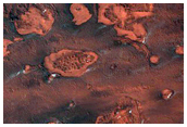 Marginal Ramparts within the Uppermost North Polar Layered Deposits