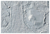 Interactions between Crater Ejecta Mantling Deposits and Flows