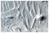 Layered Features in Tikhonravov Crater