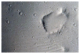Preserved Crater on Streamlined Surface