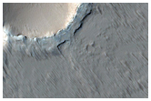 Faulted Shield Volcano with Summit Crater in Tharsis Region
