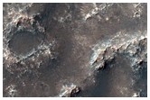 Monitor Dunes and Dark Material in Southwest Dawes Crater