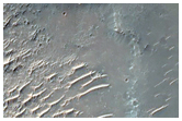 Mounds and Small Ridges along Wrinkle Ridge on Huygens Crater Floor