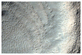 Layered Deposits in Crater in Hellas Montes Region