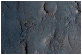 Scoured Crater Floor Adjacent to Fan-Shaped Form