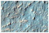 Possible Phyllosilicates and Fluvial Features Near Hashir Crater