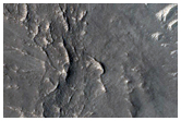 Layered Rocks on Floor of Large Ancient Crater