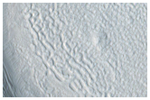 Raised-Rim Crater in Mid-Latitude Textured Crater Floor Material