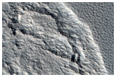 Scarp in Mantle Material in Milankovic Crater