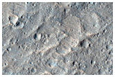 Convergent Curvilinear Ridges Immediately West of THEMIS Image V29093013