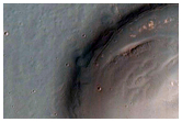 Light-Toned Layering along Floor of Small Trough Near Juventae Chasma
