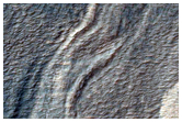 Scarp Trough and Erosion of Crater in Hellas Region
