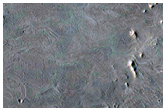 Faulted Layered Deposits in Capen Crater 

