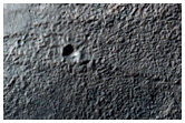 Small Crater on Rim of Hartwig Crater

