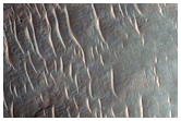 Layered Bedrock Exposed on Crater Floor
