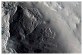 Fresh Crater Exposing Volcanic Layers
