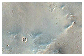 Mounds and Small Ridges along Wrinkle Ridge on Huygens Crater Floor
