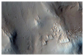 Interaction between Pedestal Crater and Scarp
