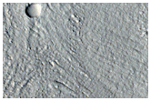 Mounds and Flow Features on Crater Floor

