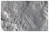Crater Ejecta Overprinting Lava Rille
