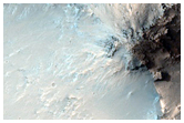 Dark Material on or in Crater Wall Associated with Intra-Crater Dunes
