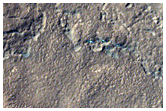Hollowed Terrain along Mounds in Ejecta
