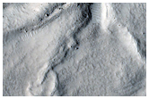 Distorted Icy Terrain in Nilosyrtis Mensae Crater
