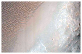 Impact Crater Exposing Bedrock
