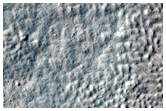 Troughs and Mounds in Crater Near Reull Vallis
