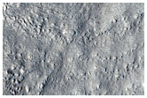 Crater with Rock Outcrops
