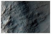 Multiple Terrains and Crater-in-Crater Scarp
