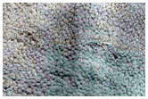 Transition from Uplands to Large Crater with Flow-Like Features along Rim
