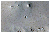 Possible Eroded Fluvial Features on Crater Floor
