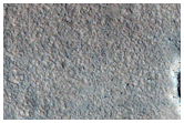 Dark Streaks Associated with Knobs in East Acidalia Planitia
