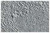 Crater and Ejecta Blanket Partly Covered by Mid-Latitude Apron
