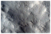 Pettit Crater Ejecta in Contact with Knobs and Massifs
