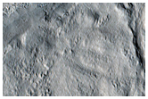 Ricochet Crater Formed from Elliptical Crater to the East
