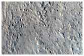 Layering in Crater Wall Near Tractus Fossae
