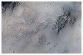 Exposed Layers in Crater in Phlegra Montes
