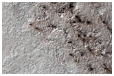 Carbon Dioxide Erosion on Rugged Terrain
