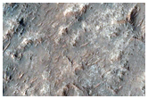 Mounds and Small Ridges along Wrinkle Ridge on Huygens Crater Floor 

