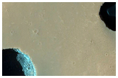 Dark Rimless Pits in Tharsis Region
