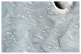 Small Valley on Sinuous Mound East of Hecates Tholus
