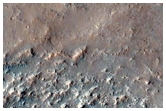 Mounds and Small Ridges along Wrinkle Ridge on Huygens Crater Floor 
