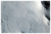 Intact Layers Exposed in the Central Uplift of a 31-Kilometer Crater
