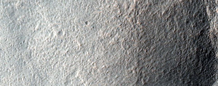 Valley Breaching Crater in Hellas Montes Region
