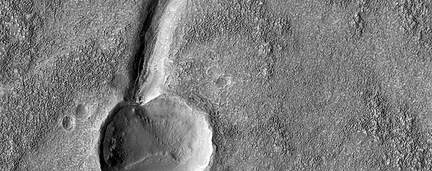 Valley Cutting Crater Along Thaumasia Plateau East of Warrego Valles
