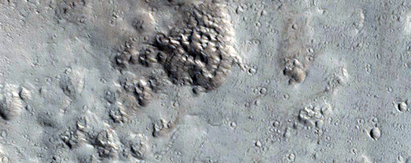 Well-Preserved 15-Kilometer Diameter Crater Near Alba Mons
